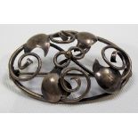 Arts & Crafts white metal oval brooch, possibly by Mumford of Falmouth, wire scroll design with four