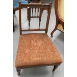 Victorian rosewood fireside low chair with stuff over upholstered seats.