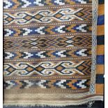 Kelim flat weave rug of geometric band design upon an orange and blue ground, width 44in x length