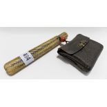 Japanese carved bone pipe holder and cover simulating basket weave with a leather tooled pouch,
