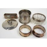 Pair of silver napkin rings, Chester 1923; together with another silver napkin ring, continental