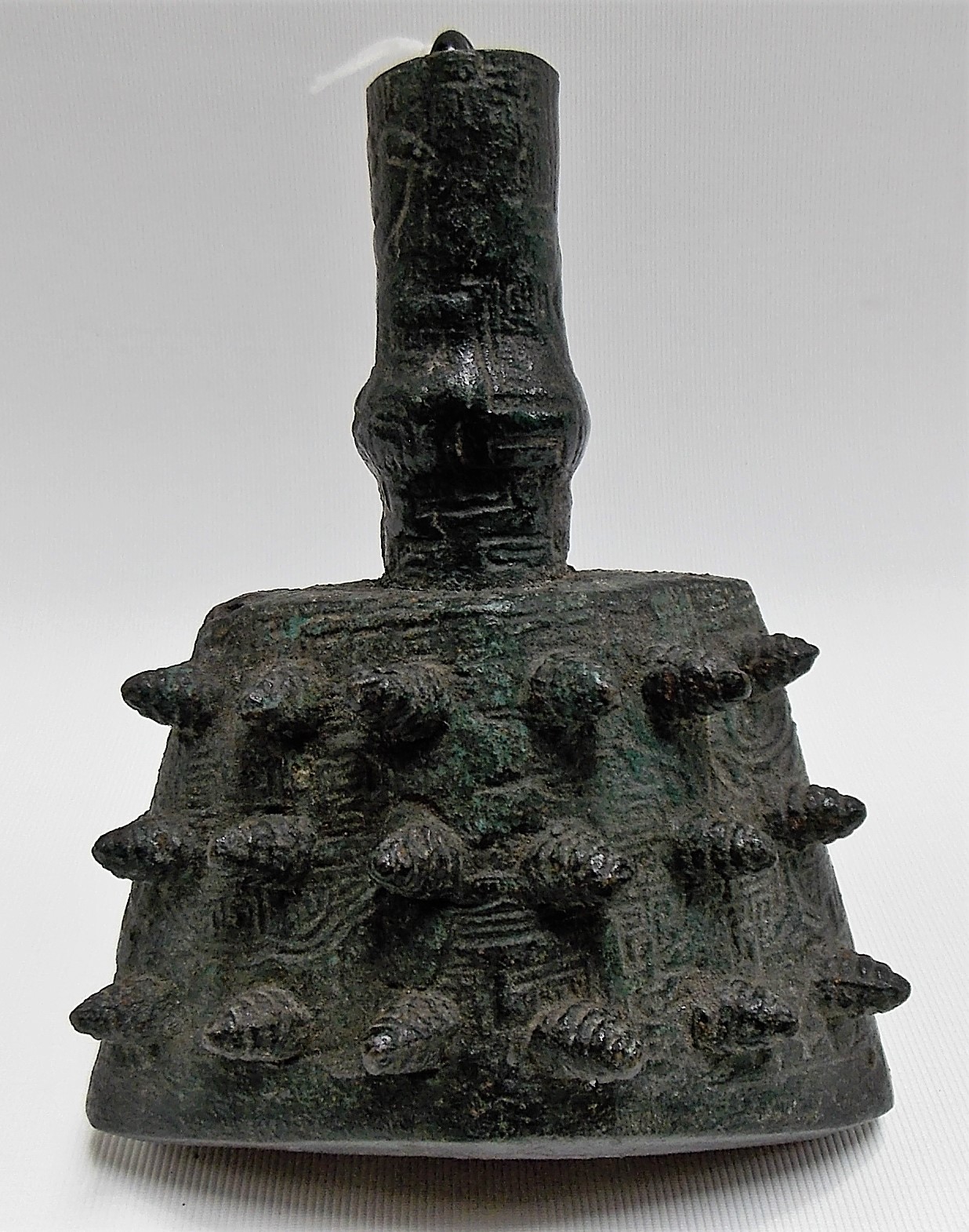 Chinese Archaic triangular section prayer bell cast with multiple knops upon a key ground, height - Image 2 of 3