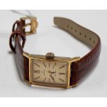 Omega ladies gold plated manual wind wristwatch with square gilt dial with baton markers, the