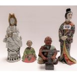 Four oriental figures including a porcelain blanc de chine figure of Guanyin (af), a standing