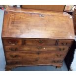 George III mahogany bureau, the fall front enclosing a fitted interior with concealed compartments