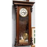 Vienna two train wall clock with walnut case, height 35in.