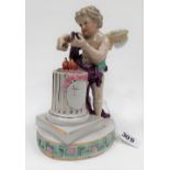 19th Century Dresden porcelain group depicting a cupid mixing a love potion upon a plinth, blue