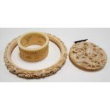 Early 20th Century Chinese export ivory foliate carved bangle, napkin ring and circular dragon