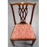 George III mahogany set of six Chippendale style dining chairs with shaped top rails over a