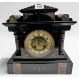 Black slate and marble two train mantel clock with French movement and within architectural case,