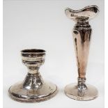 STERLING weighted squat candlestick; together with a silver weighted bud vase, Chester 1914 (both