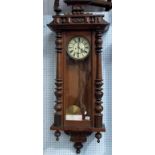 Vienna two train wall clock with walnut case, height 50in.
