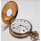 9ct gold half hunter crown wind pocket watch, the white enamel dial with Roman Numerals and