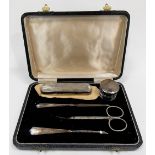 Engine turned five-piece manicure set within fitted case, stainless steel scissors