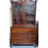 William IV mahogany secretaire bookcase, the shaped cornice with blind frets over a pair of astragal