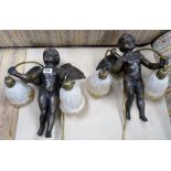 Pair of late 20th Century Chinese bronze twin branch wall lights in the form of cherubs holding