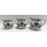 Set of three graduated Fielding's Devon ware jugs, each decorated with stylised flowers, pattern no.