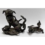 Chinese small bronze model of a Buddhist lion, height 3.5in together with a small Chinese bronze