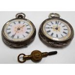 Two silver cased fob watches both with foliate embossed cases, key