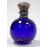 Small ovoid cobalt blue glass scent bottle with gilt worn crosshatch decoration and with white metal