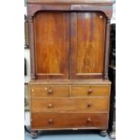 Victorian mahogany veneered linen press, the pair of cupboard doors flanked by wrythen turned