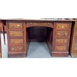 Early 20th Century twin pedestal desk with rexene inset over an arrangement of nine drawers, width