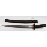 A Japanese short sword with lacquer sheath, the shagreen handle bound in fabric with Menuki and ring