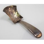 George IV silver caddy spoon of shovel form, the bowl foliate engraved, maker John Thornton,