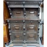 A 17th Century style Dutch carved oak court cupboard, carved overall with lion heads and figures,