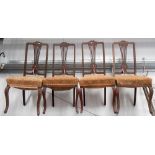 Set of four Edwardian mahogany salon chairs with stuff over seats and cabriole forelegs.