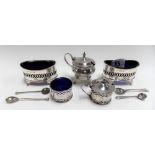 Pair of Victorian silver oval salts with pierced band and blue glass liners, Birmingham 1898;