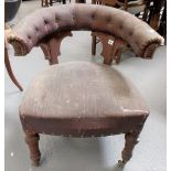 Victorian reading chair with button back upholstered back and stuff over seats upon turned