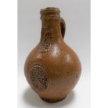 17th Century Bellarmine stoneware jug , the body with a central oval medallion, height 8.25in.