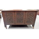 Early 20th Century oak arts and crafts coffer, the front and sides carved with foliate scroll