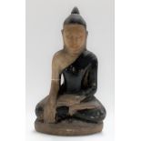 A Chinese carved marble painted figure of a Buddha, seated in Dhyanasana, wearing black painted