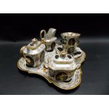 19th Century porcelain cabaret set for two, foliate spray painted with gilt highlights & with four