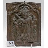 Indian copper embossed rectangular plaque depicting a four arm deity under a triform arch, height