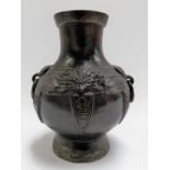 Chinese archaic bronze ovoid vase with ring handles, the body case with a band with lappets,