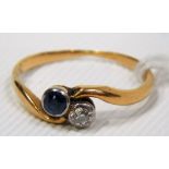 Yellow metal diamond and sapphire set two stone ring, the diamond of 0.07ct spread approx, weight