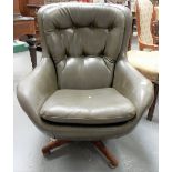 Mid Century green leather Parker Knoll pod armchair.