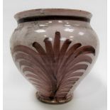 An antique tin glazed pottery baluster vase painted to both sides with manganese brushwork upon a