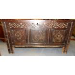 18th Century oak panelled coffer, the front with foliate scroll carved frieze, the three panels with