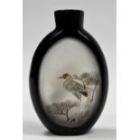 Chinese black glass overlay snuff bottle, decorated on one side with a stork on branch, on the other