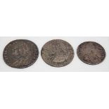 George II silver milled 1758 shilling; together with a William III sixpence dated 1697; together