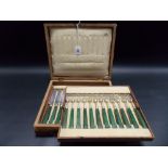 George III silver and green stained ivory handle 12 setting fruit knife and fork set, within