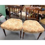 Two 19th Century mahogany dining chairs and stuff over seats.