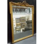 Bevel edged gilt gesso framed rectangular wall mirror with ribbon foliate swag surmount, height