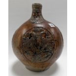 Large 17th Century Bellarmine jug, the ovoid body with three oval armorial devices, height 13in (