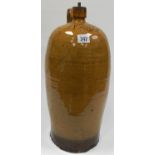 19th Century slipware large storage bottle, possibly North Devon with light brown glaze, the