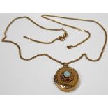 Yellow metal oval locket set an oval opal; upon a slender curb link necklace (broken), weight